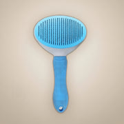Brosse démêlante auto-nettoyante pour chien et chat
