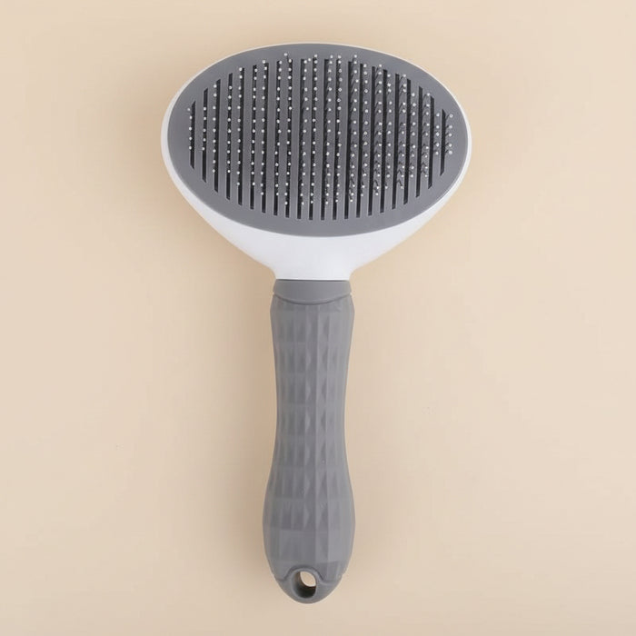 Brosse démêlante auto-nettoyante pour chien et chat